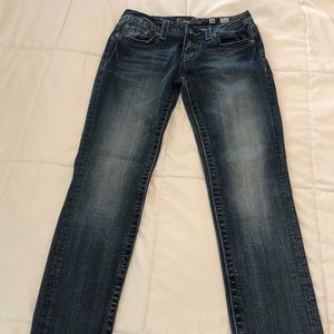 Miss Me Jean, “Cross” embezzlement on back pockets